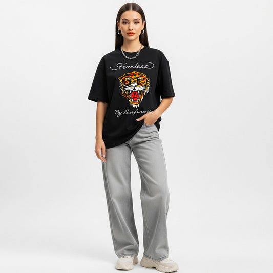 Woman wearing a black t-shirt with a tiger graphic and text on a white background