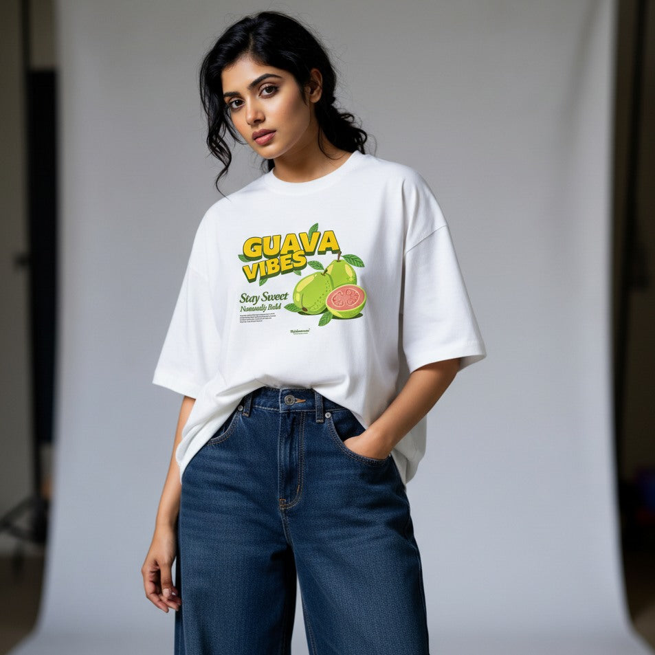 Person wearing a white t-shirt with 'Guava Vibes' graphic design on a plain background