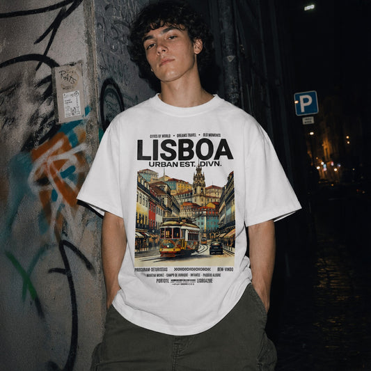 Person wearing a white t-shirt with 'Lisboa' design standing against a graffiti-covered wall at night.