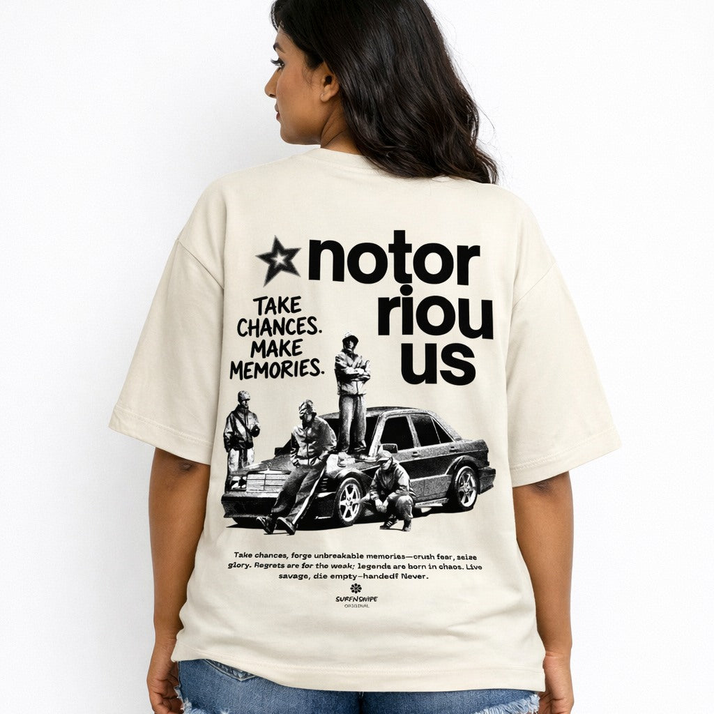 Person wearing a t-shirt with a graphic and text on the back, standing against a white background