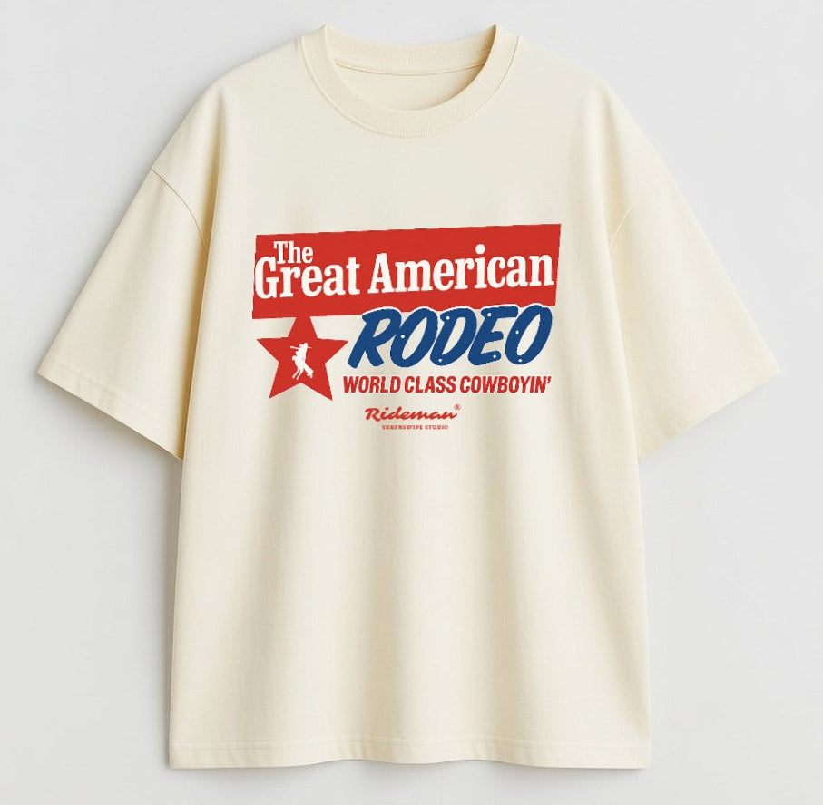 Beige t-shirt with 'The Great American Rodeo' graphic on a light gray background