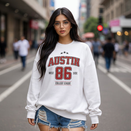 Woman wearing a white sweatshirt with 'Austin 86' text on a city street.