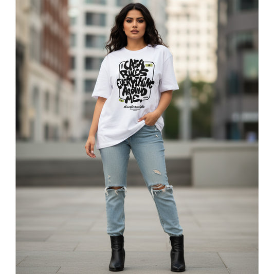 Woman wearing a white t-shirt with text and light blue jeans in an urban setting