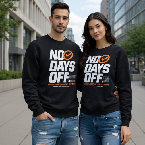 Two people wearing black sweatshirts with 'NO DAYS OFF' text in an urban setting.