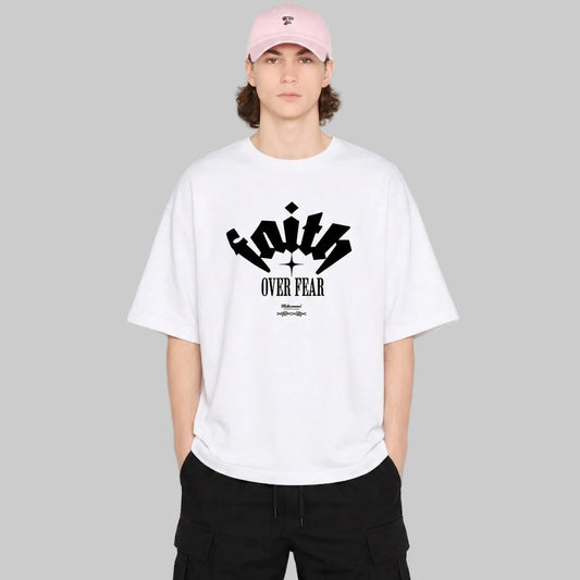 Person wearing a white t-shirt with black text and graphics on a plain background