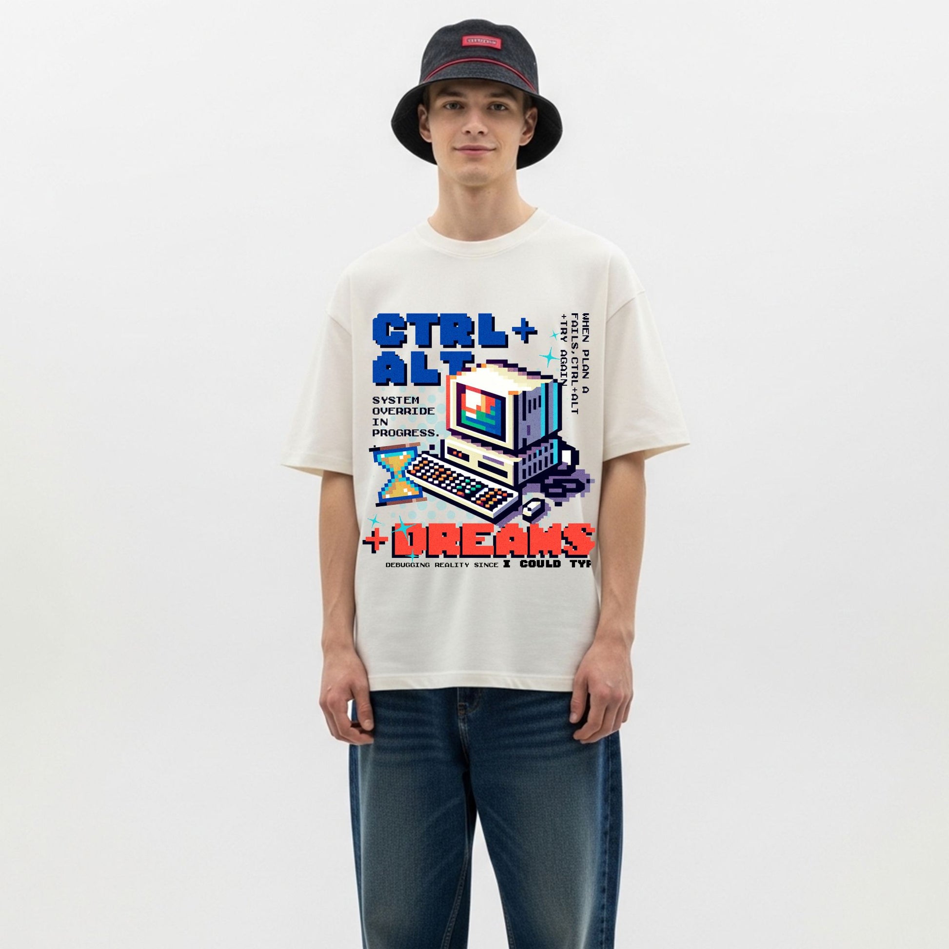 Person wearing a white t-shirt with a graphic design on a plain background