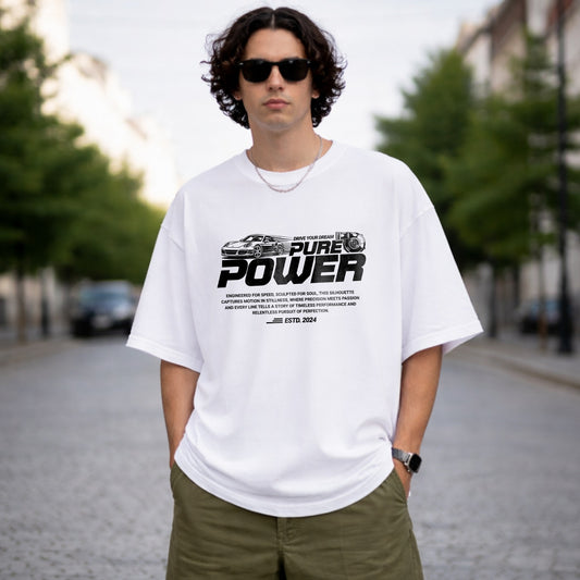 Person wearing a white t-shirt with 'PURE POWER' text and graphics outdoors.