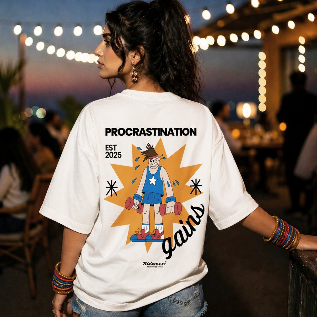 Person wearing a white t-shirt with a graphic design and text, standing outdoors at night.