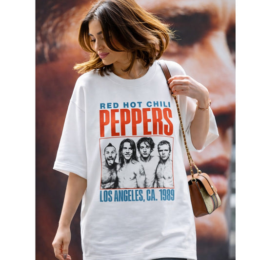 Woman wearing a Red Hot Chili Peppers t-shirt with band members' photo and text.