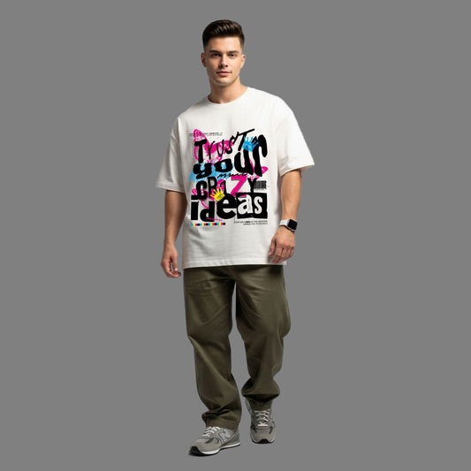 Man wearing a white t-shirt with colorful text design on a gray background