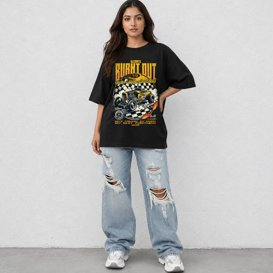 Woman wearing SURFNSWIPE Burnt Out Hot Rod oversized T-shirt in black styled with ripped wide-leg jeans