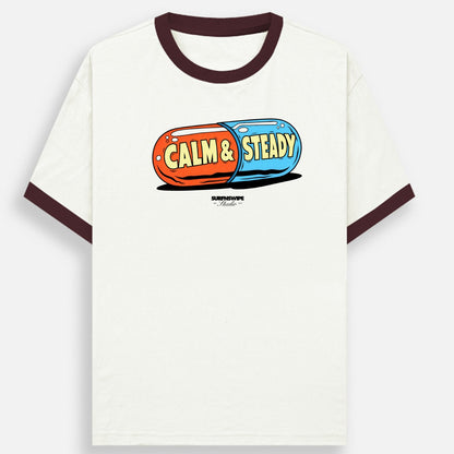 White t-shirt with 'Calm & Steady' graphic design on a white background