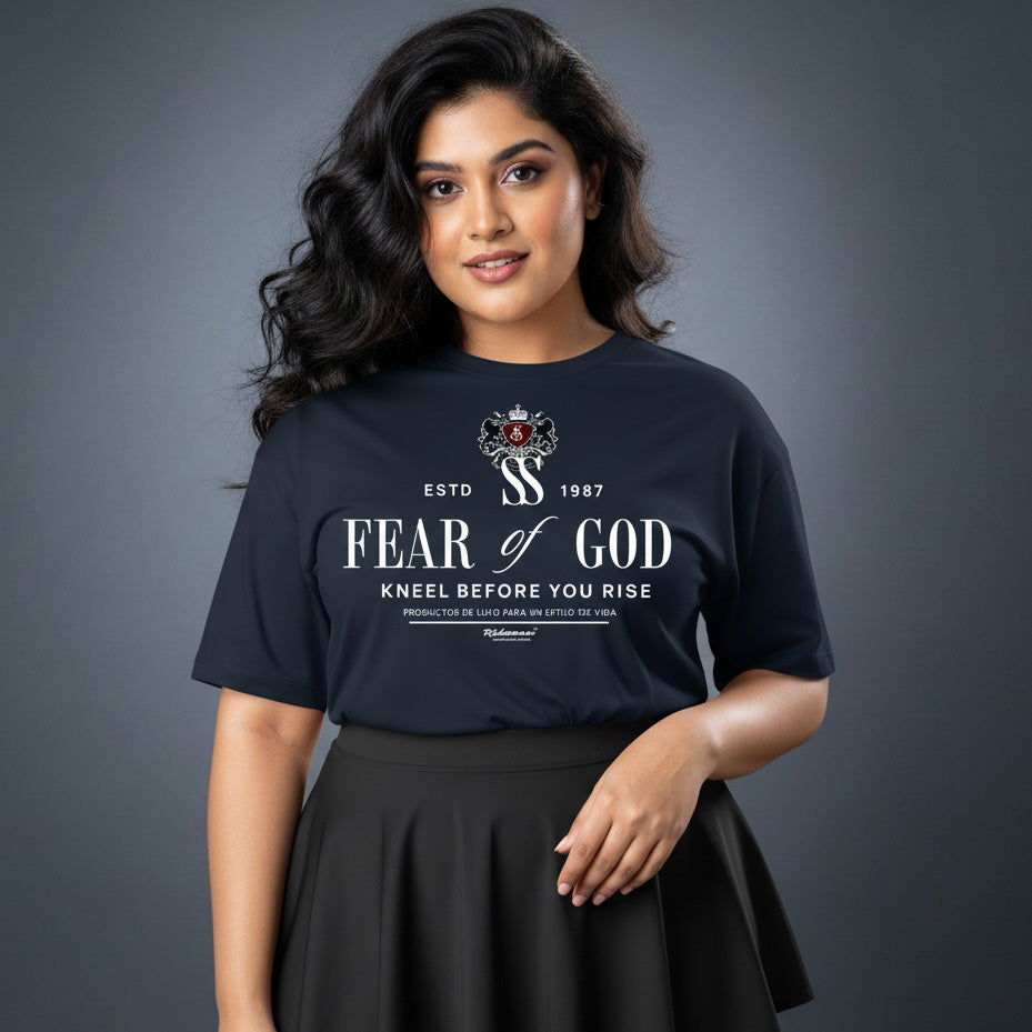 Woman wearing a black t-shirt with 'Fear of God' text and logo on a gray background