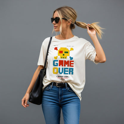 Woman wearing a white t-shirt with 'GAME OVER' graphic design on a gray background