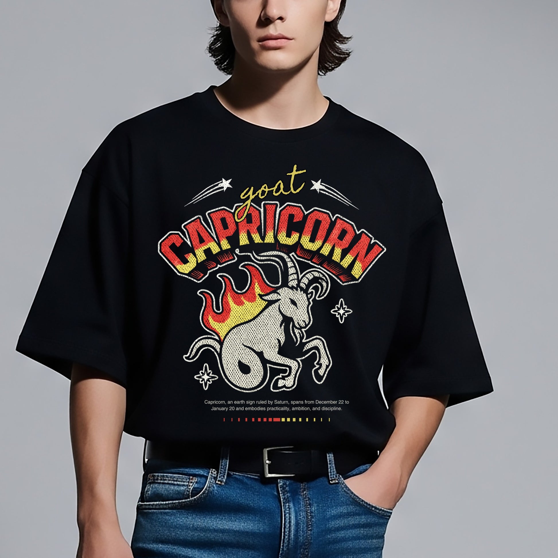 Person wearing a black t-shirt with Capricorn zodiac design on a gray background