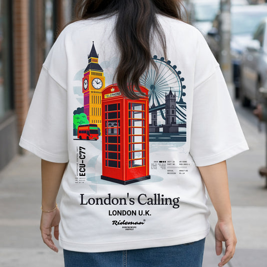 Person wearing a white t-shirt with London-themed graphics and text.