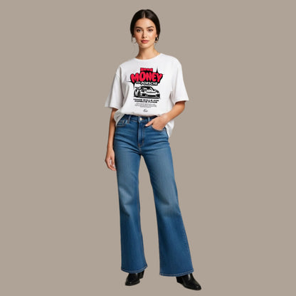 Woman wearing a white t-shirt with graphic design and blue jeans on a neutral background