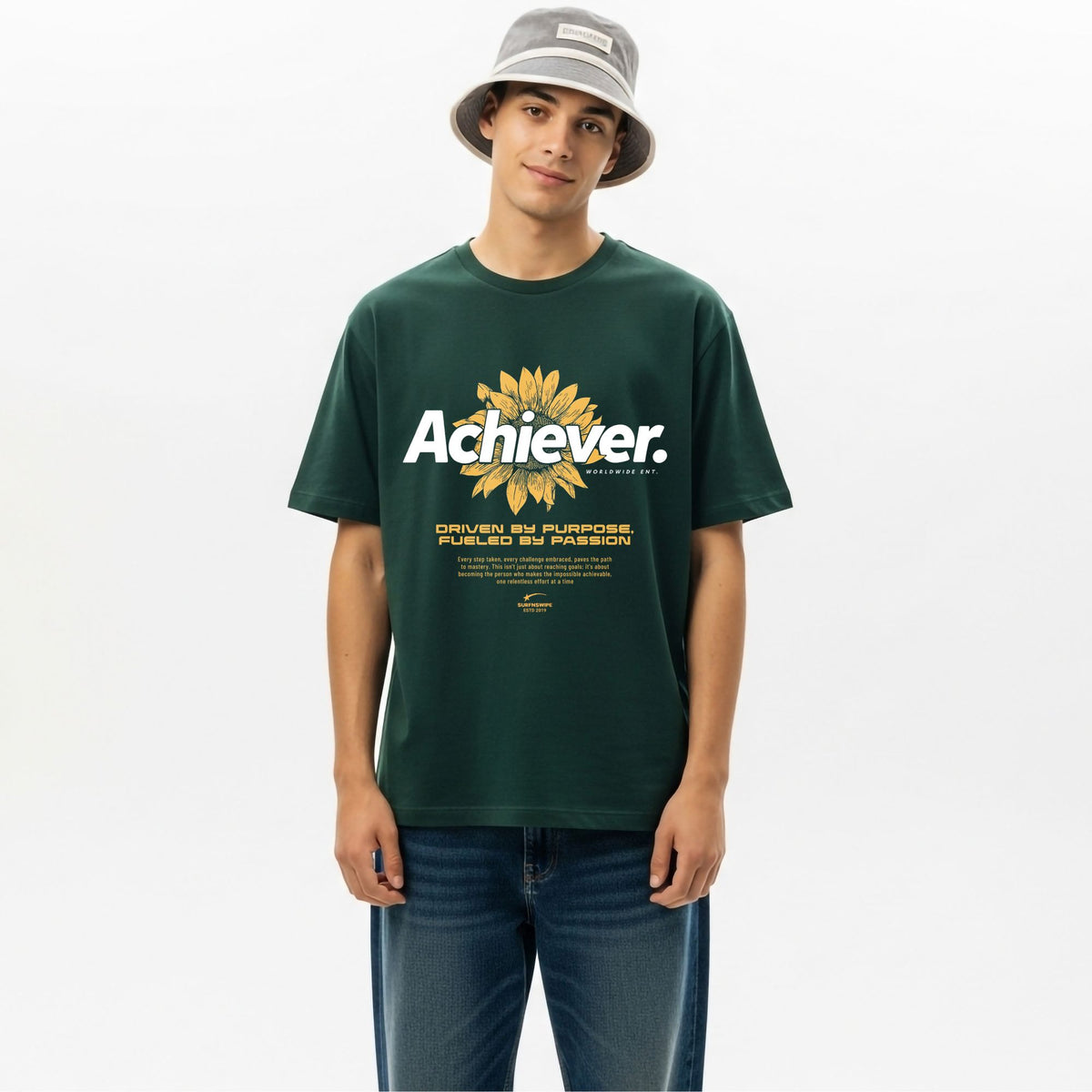 Person wearing a oversized green t-shirt with 'Achiever' design on a white background