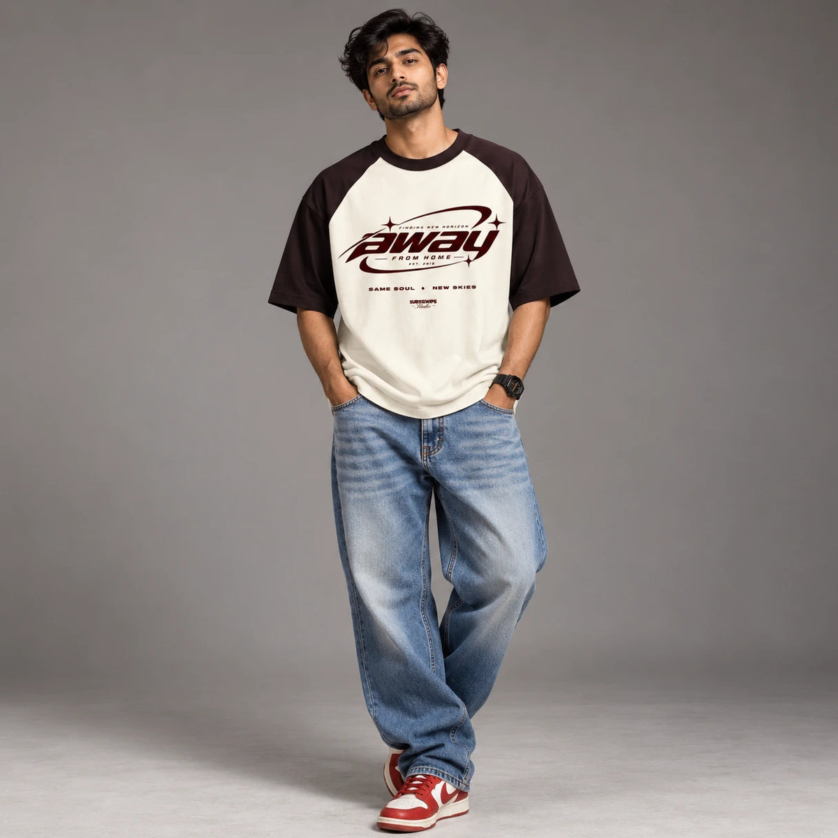 Close-up detail of the Away From Home maroon and off white colour block tee
