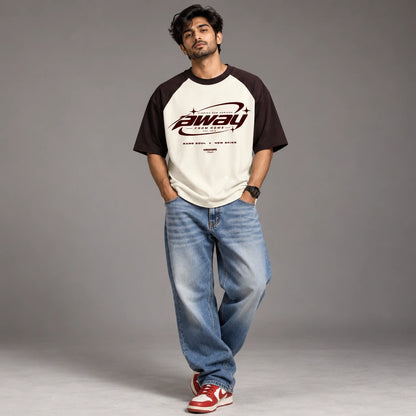 Close-up detail of the Away From Home maroon and off white colour block tee