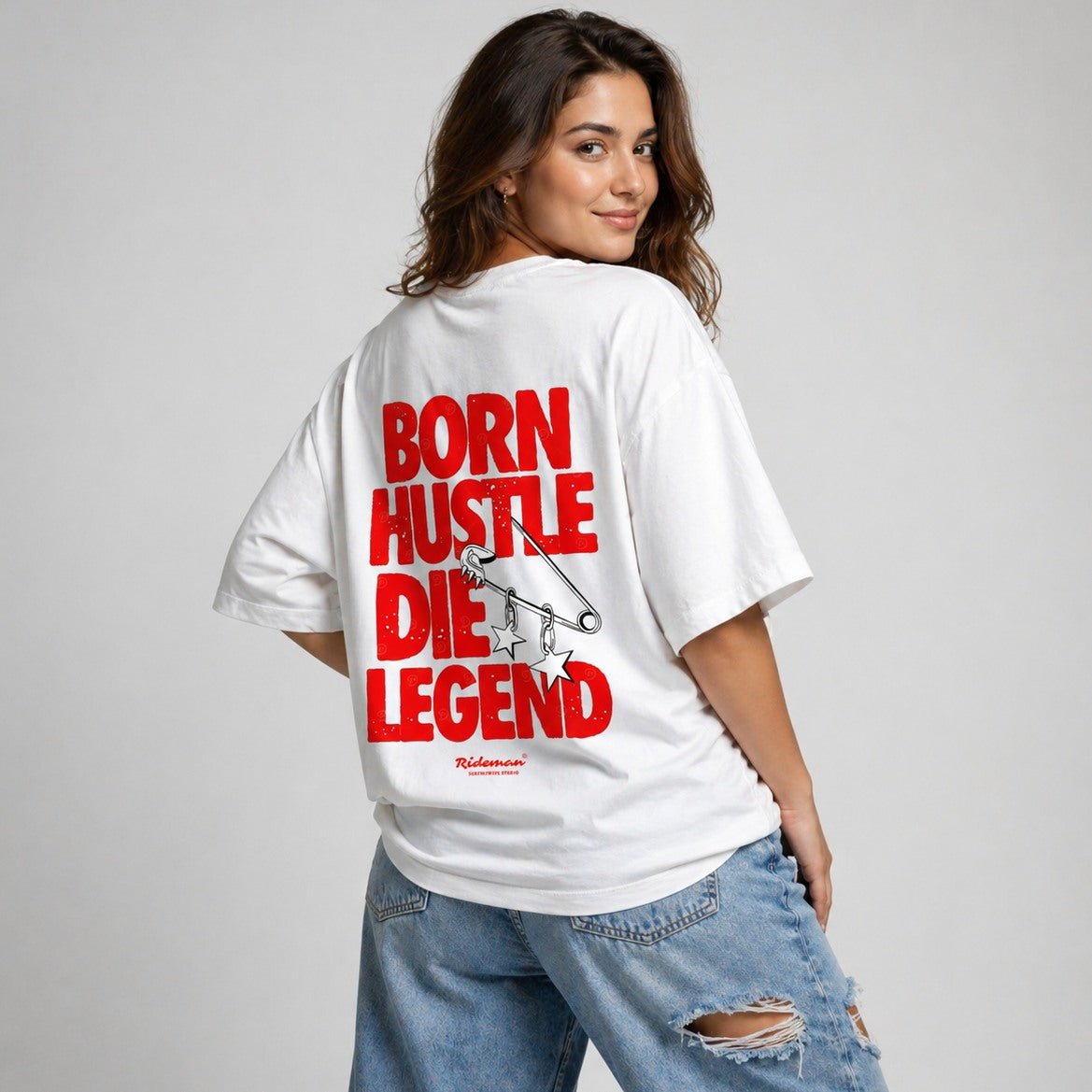 Person wearing a white t-shirt with red text and graphic design on a plain background