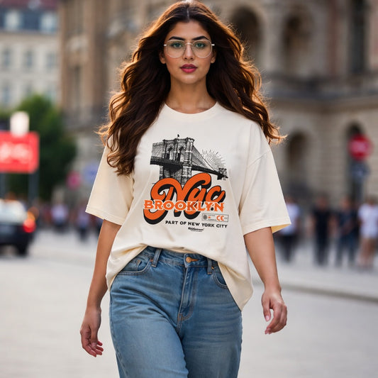 Woman wearing a t-shirt with a graphic design walking on a street.