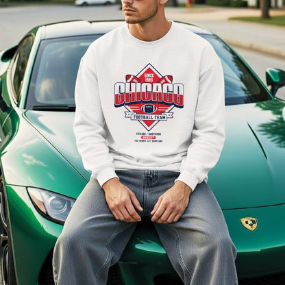 Person wearing a white sweatshirt with 'Chicago Football Team' design sitting on a green sports car.