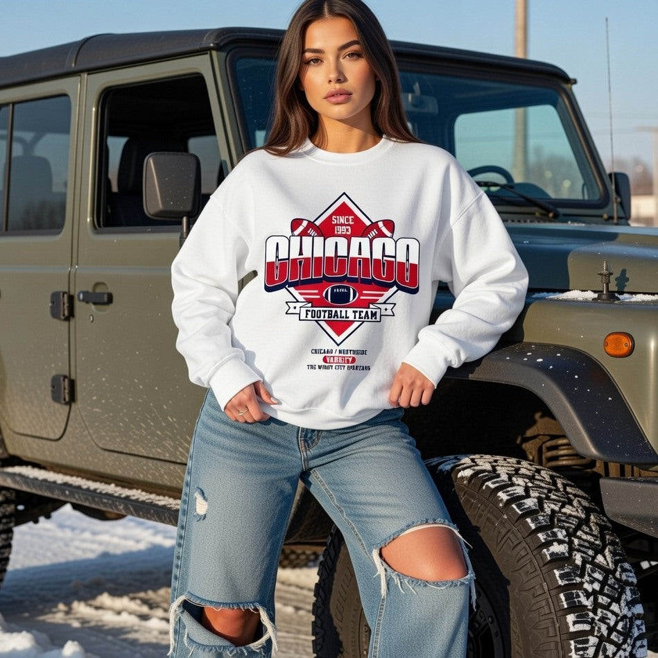 Woman wearing a white sweatshirt with 'Chicago Football Team' design in front of a green Jeep.