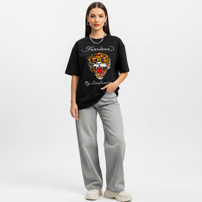 Woman wearing a black t-shirt with a tiger graphic and text on a white background