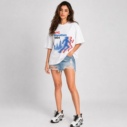 Woman wearing a white NYC MARATHON 1994 printed t-shirt.