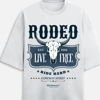 Front view of  white t-shirt with 'Rodeo Live Free' design in a living room.