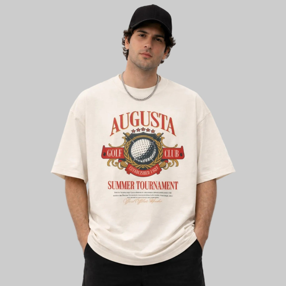 Man wearing a white t-shirt with Augusta Golf Club design on a gray background