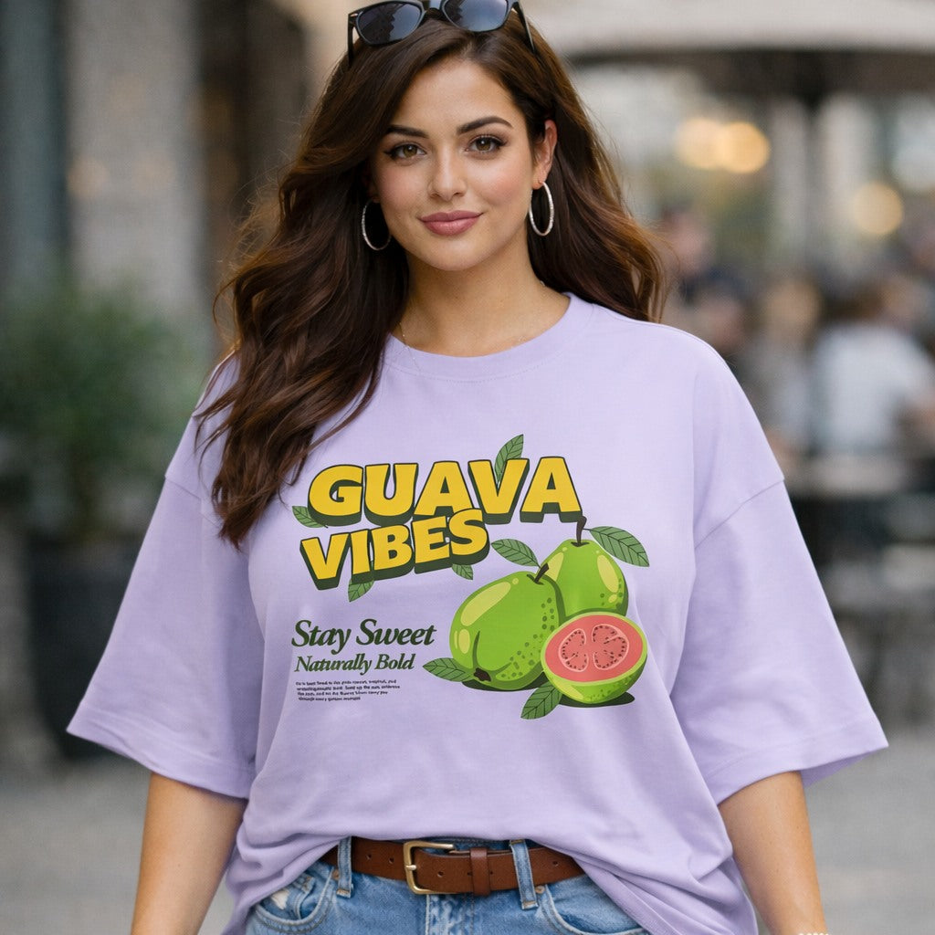 Woman wearing a purple t-shirt with 'Guava Vibes' graphic design.