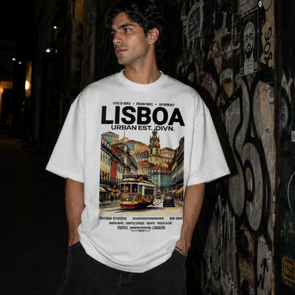 Person wearing a t-shirt with 'Lisboa' design standing against a graffiti-covered wall.