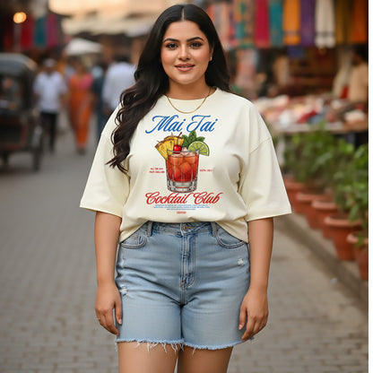 Woman wearing a 'Mai Tai Cocktail Club' t-shirt on a street background