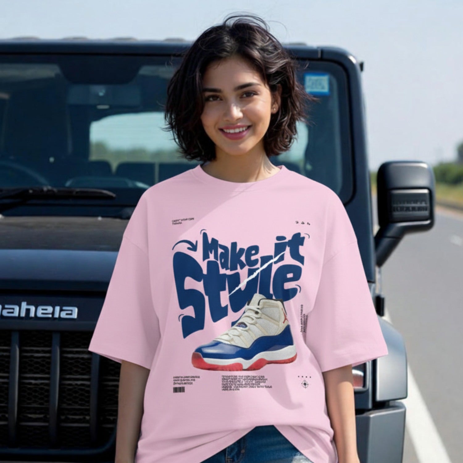 Person wearing a pink t-shirt with graphic design in front of a vehicle