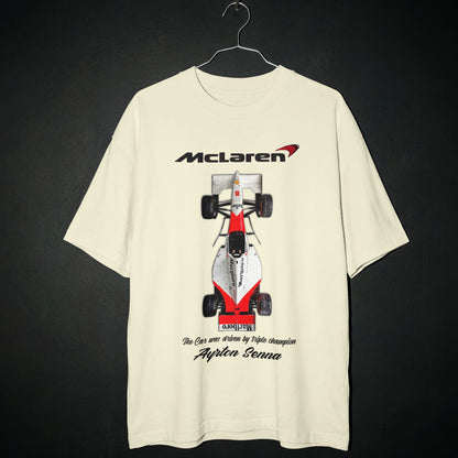 Beige t-shirt with McLaren Formula 1 car graphic on a dark background