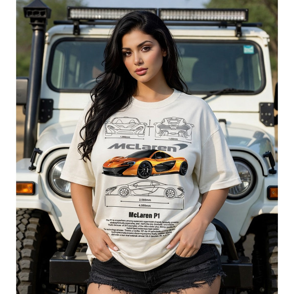Woman wearing a white t-shirt with McLaren car graphics in front of a white SUV.