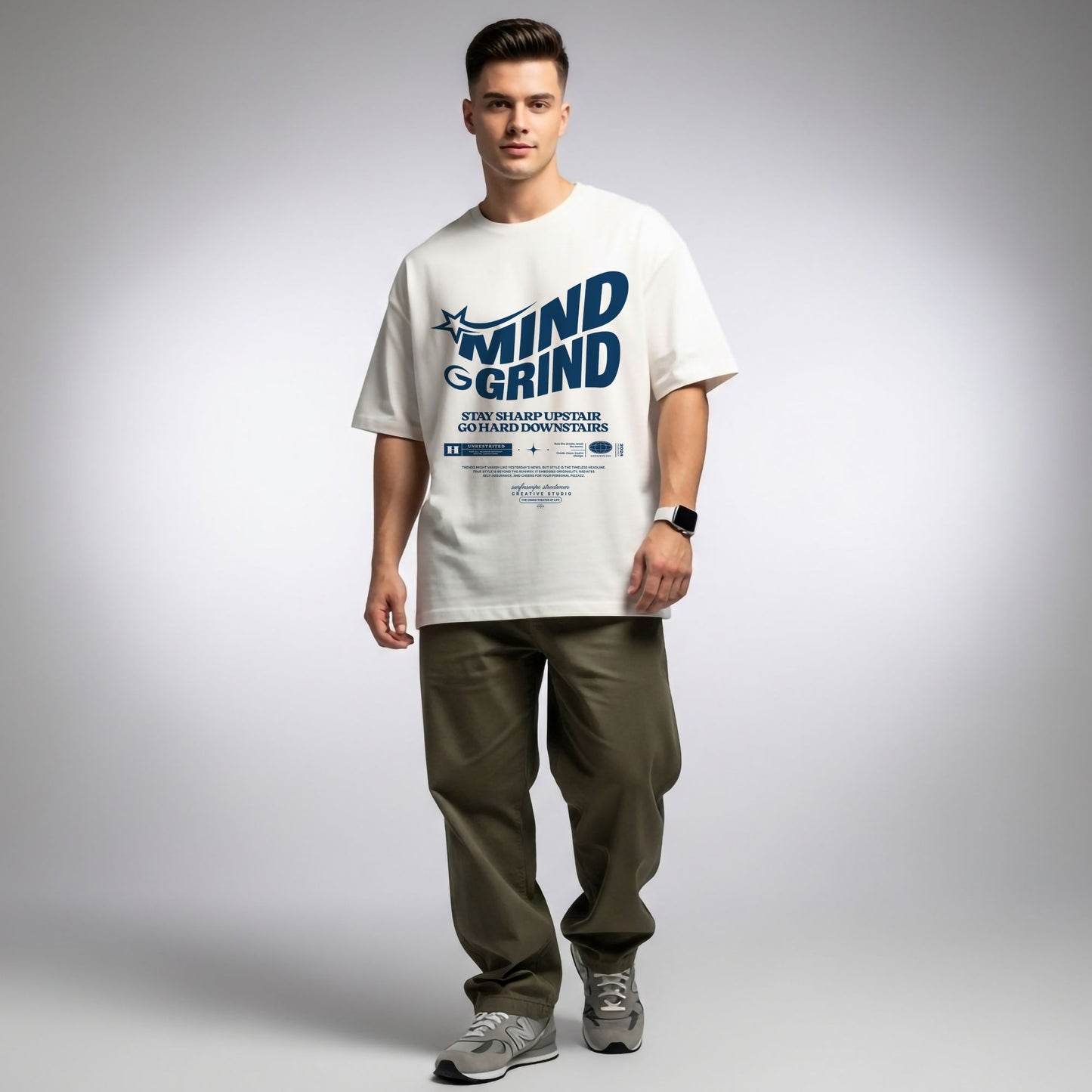 Man wearing a white t-shirt with text and graphics on a plain background