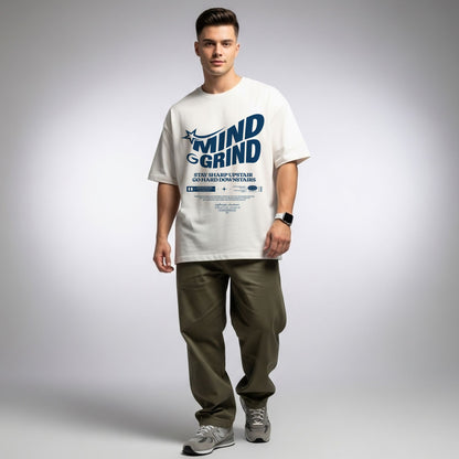 Man wearing a white t-shirt with text and graphics on a plain background
