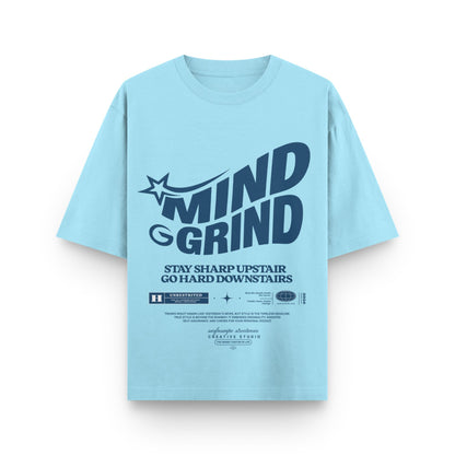 Light blue t-shirt with 'MIND GRIND' text on a white background