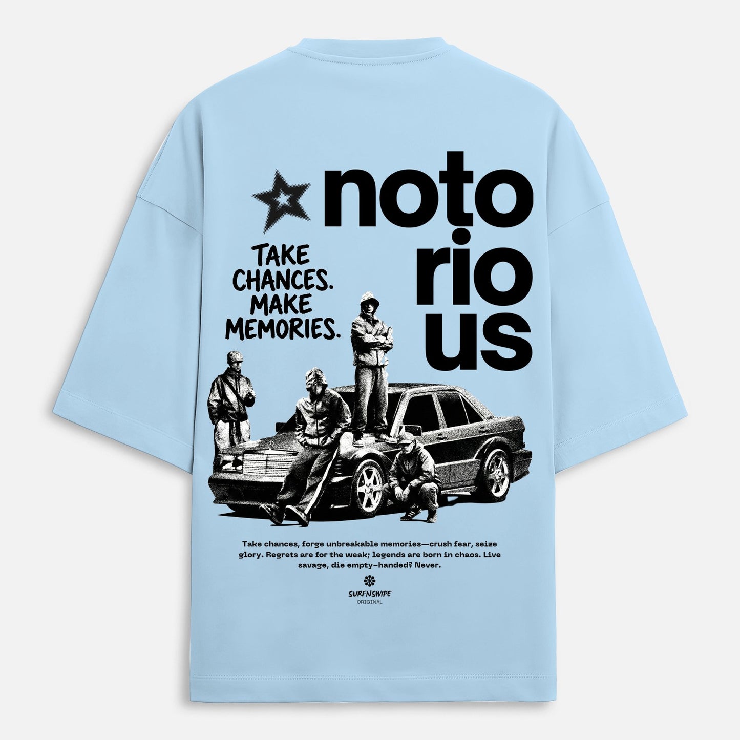 Light blue t-shirt with graphic design and text on the back, featuring a car and people.