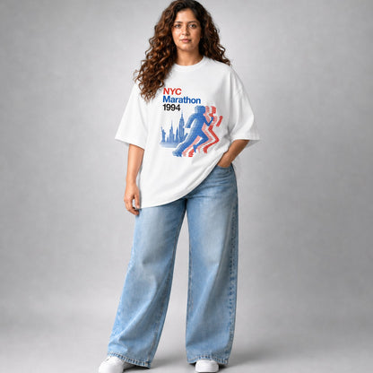Person wearing a white t-shirt with NYC Marathon 1994 design and light blue jeans on a gray background