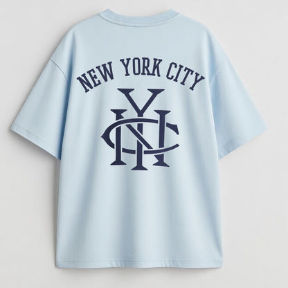 Light blue t-shirt with 'New York City' text and logo on a plain background