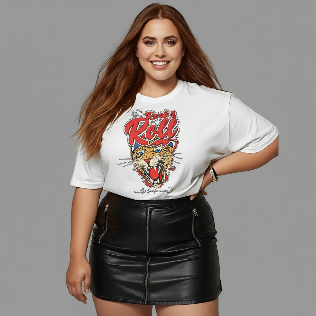 Woman wearing a white t-shirt with a graphic design and a black leather skirt on a plain background