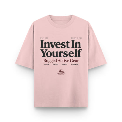 Pink t-shirt with motivational text on a white background