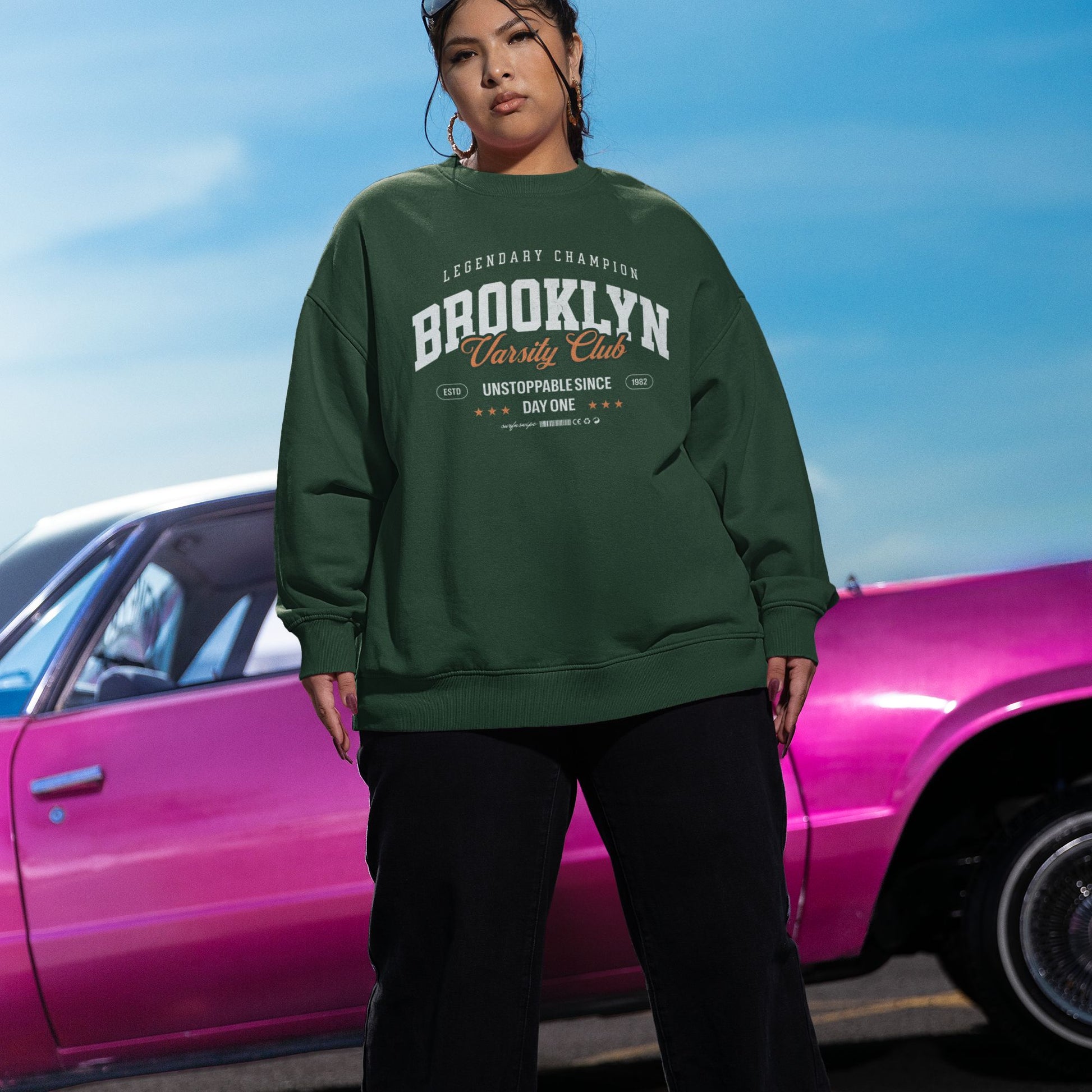 Model wearing oversized varsity sweatshirt streetwear style