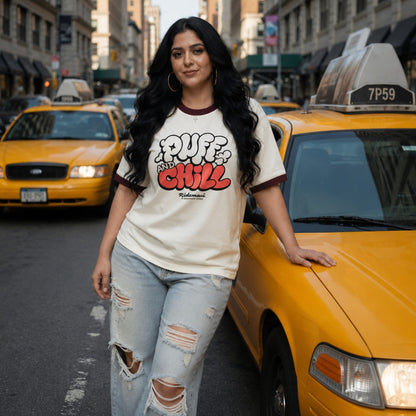 Woman wearing a 'Put In & Chill' shirt standing next to a yellow taxi in an urban setting.