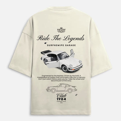 Beige t-shirt with car graphics and text on a white background