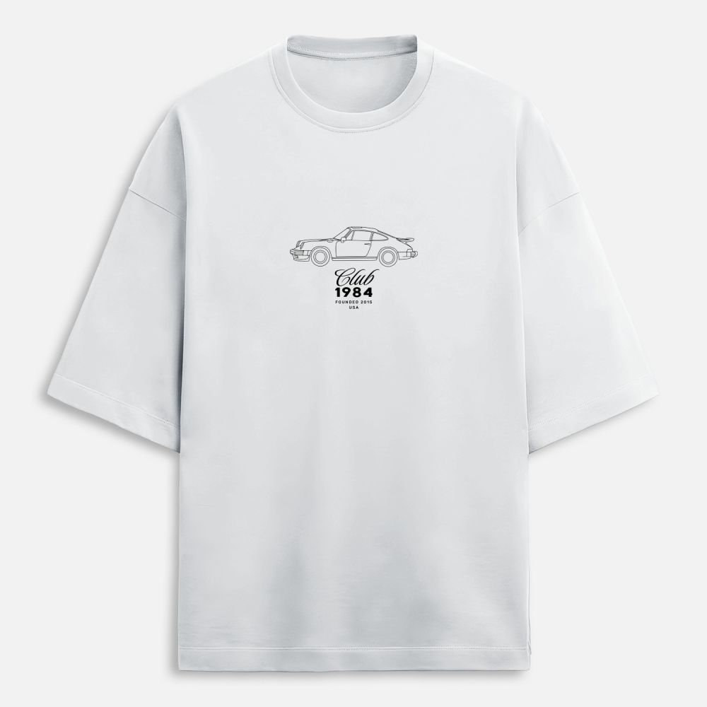 White t-shirt with car graphic and text on a white background